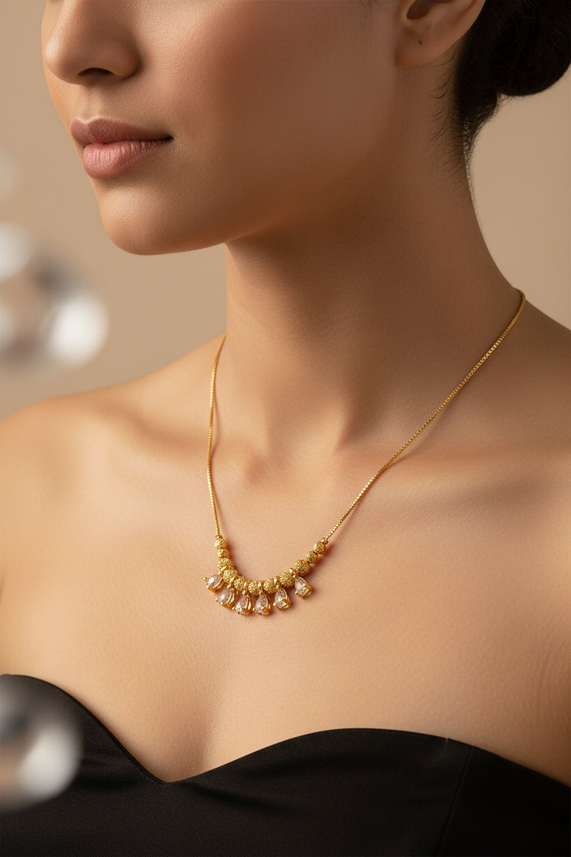 HEMA AD DANGLING BALL GOLD PLATED CHAIN (16”)